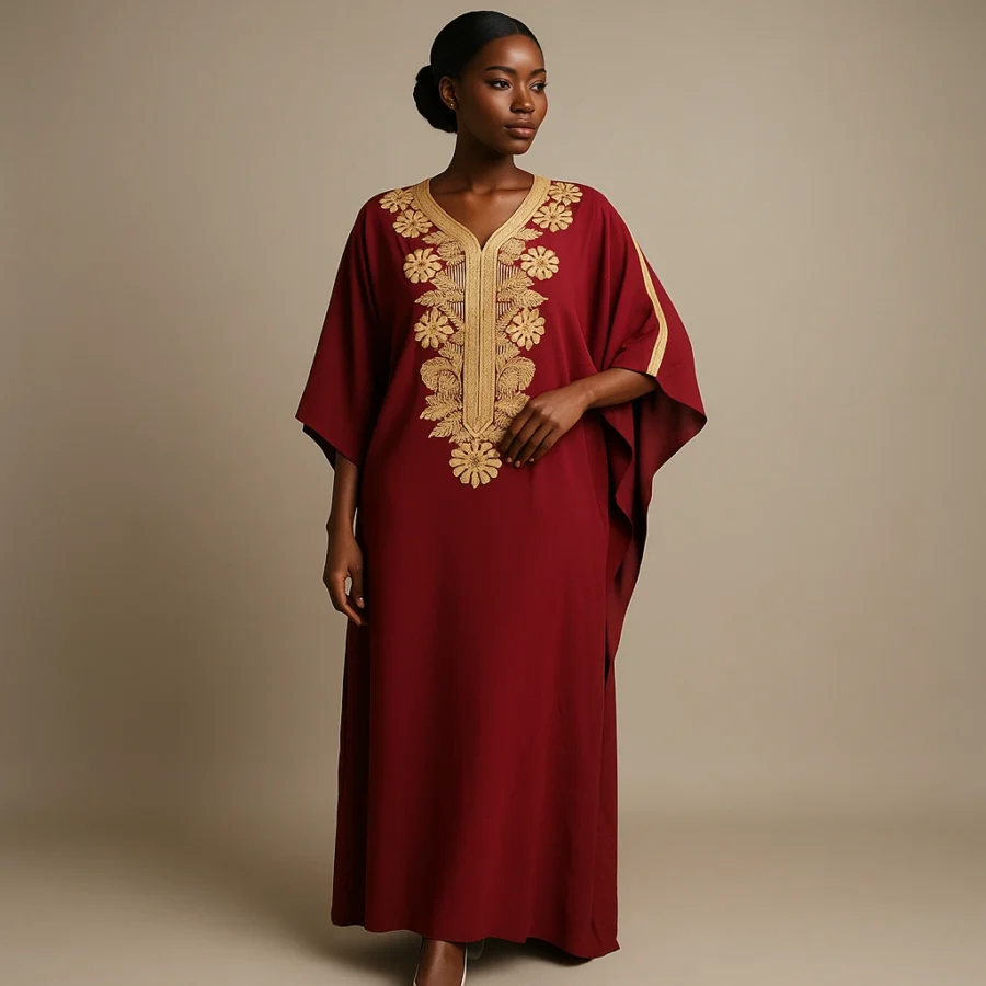 Vue de face du caftan grenat avec broderies florales dorées, style traditionnel marocain.