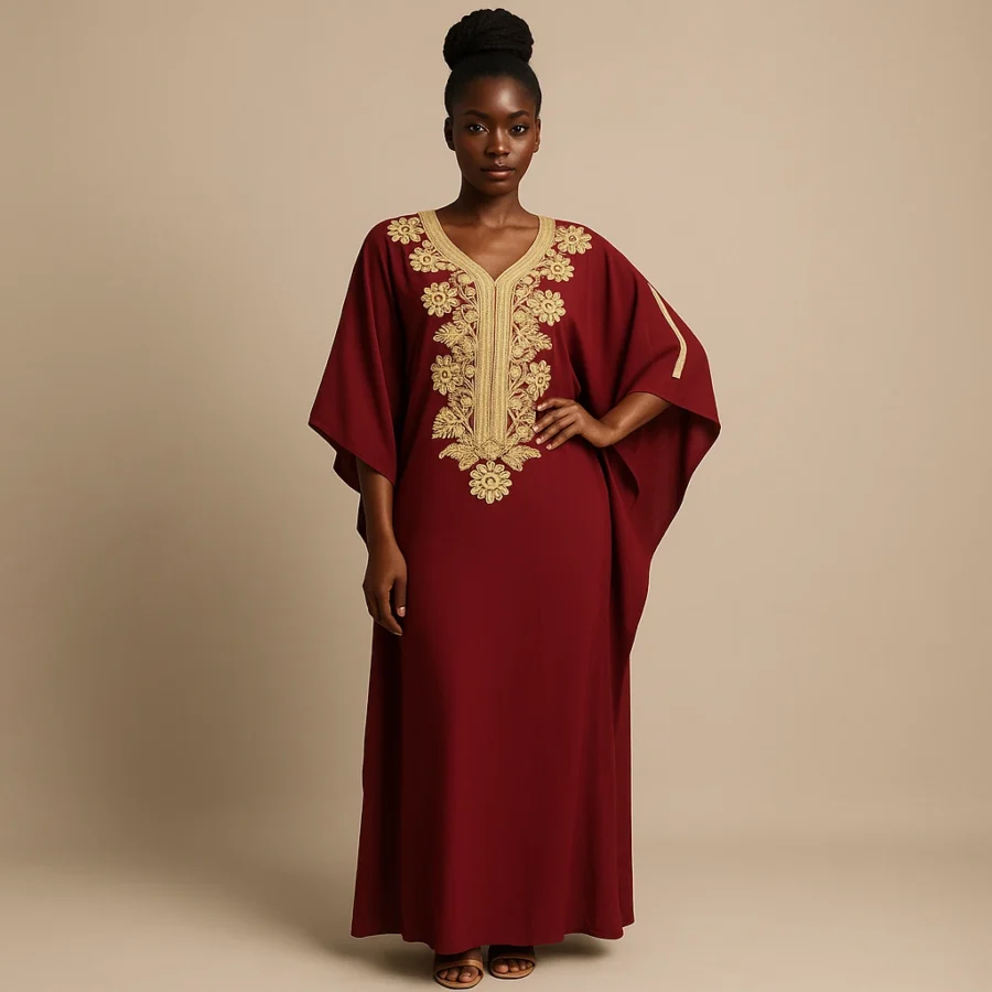 Vue de face du caftan grenat avec broderies florales dorées, style traditionnel marocain.