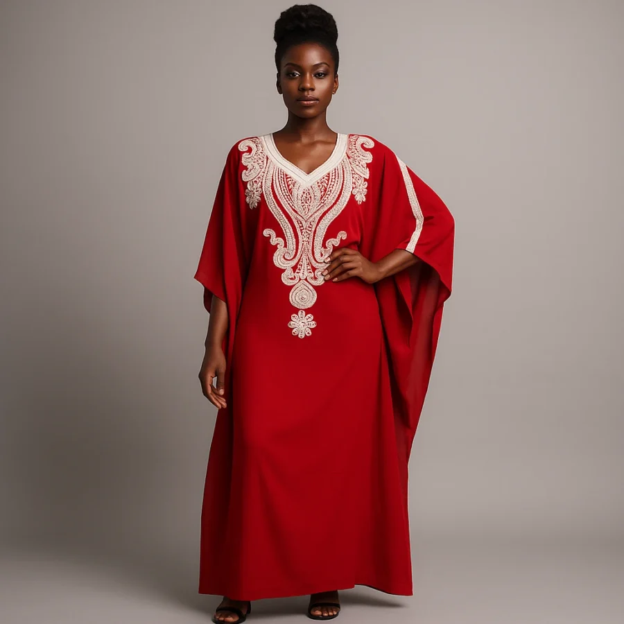 Élégance africaine en caftan rouge profond, coupe fluide et détails artisanaux.