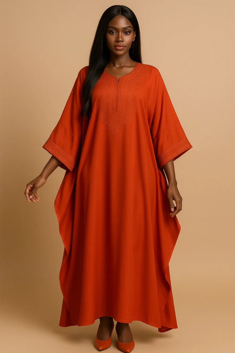 Caftan orange éclatant brodé – robe fluide à manches papillon pour femme noire, style marocain contemporain.