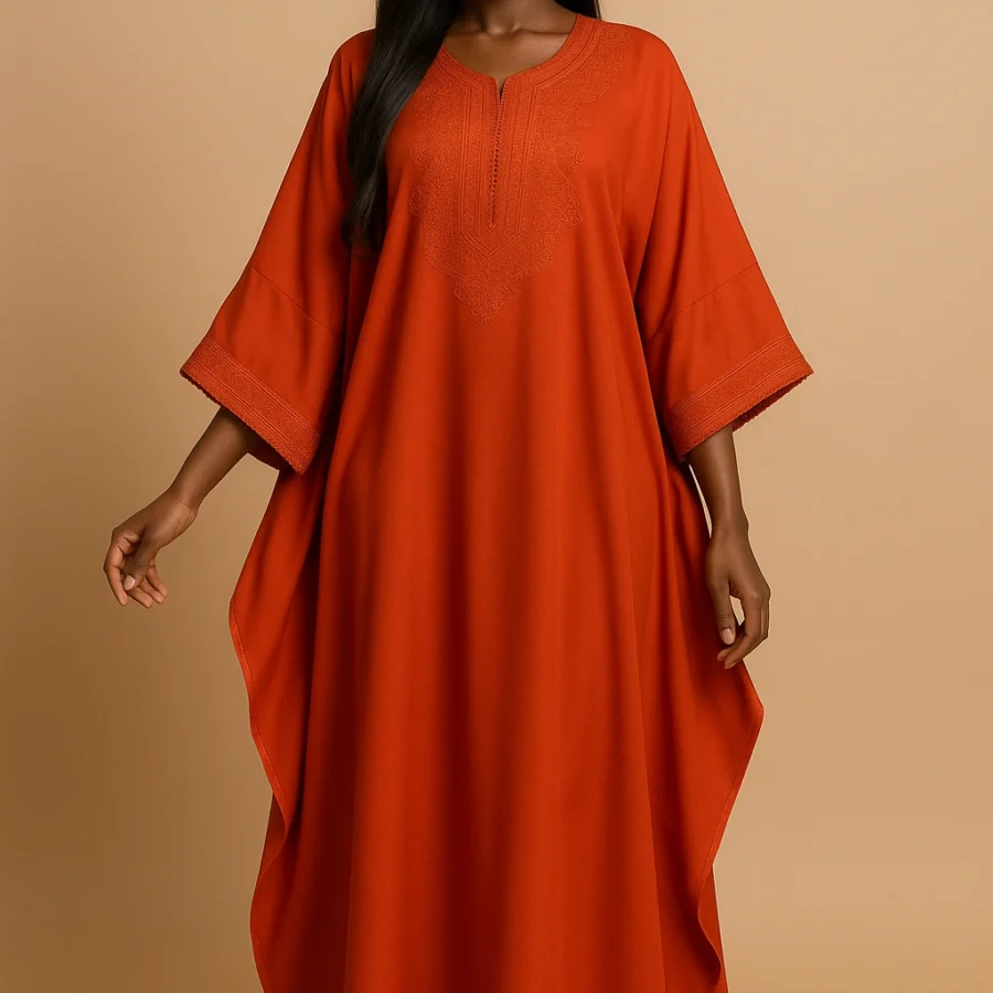 Caftan orange éclatant brodé – robe fluide à manches papillon pour femme noire, style marocain contemporain.
