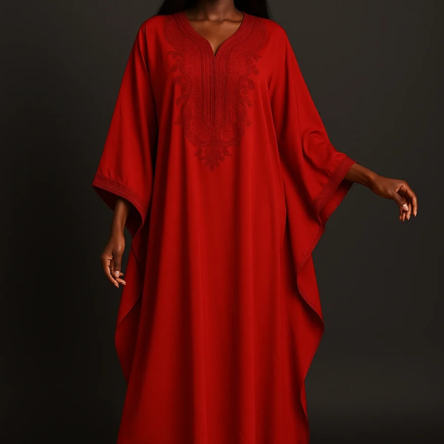 Caftan rouge profond avec broderie rouge – vêtement cérémonial marocain pour femme noire élégante.